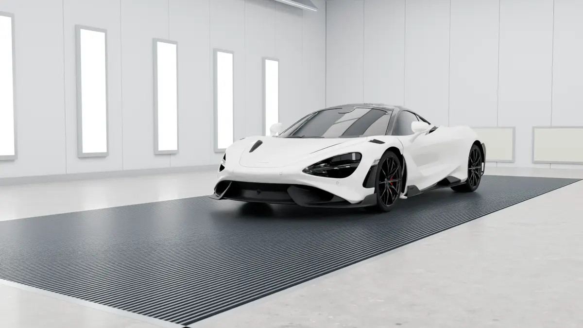 Finished white supercar in the paint booth